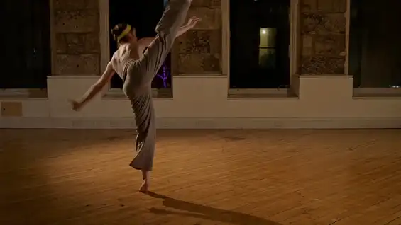 Still image of dancer Catriona Robertson performing with the Sonified Body system by Tim Murray-Browne and Panagiotis Tigas. Image by Alan Paterson.
