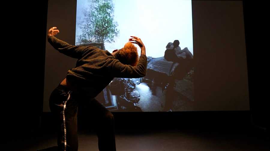A still of dancer Lenataa S. Goka improvising with Self Absorbed at the Choreographic Coding Lab 2022 in Chatham UK. Photo by Aoi Nakamura.