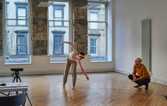 Photo of dancer Catriona Robertson working with Tim Murray-Browne in a studio at the Centre for Contemporary Arts, Glasgow. Photo by Alan Paterson.
